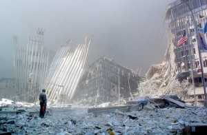 A man stands in the rubble, and calls out asking if anyone needs help, after the collapse of the first World Trade Center Tower 11 September, 2001, in New York. Two hijacked planes crashed into the twin towers causing the collapse of both. AFP PHOTO Doug KANTER (Photo credit should read DOUG KANTER/AFP/Getty Images)