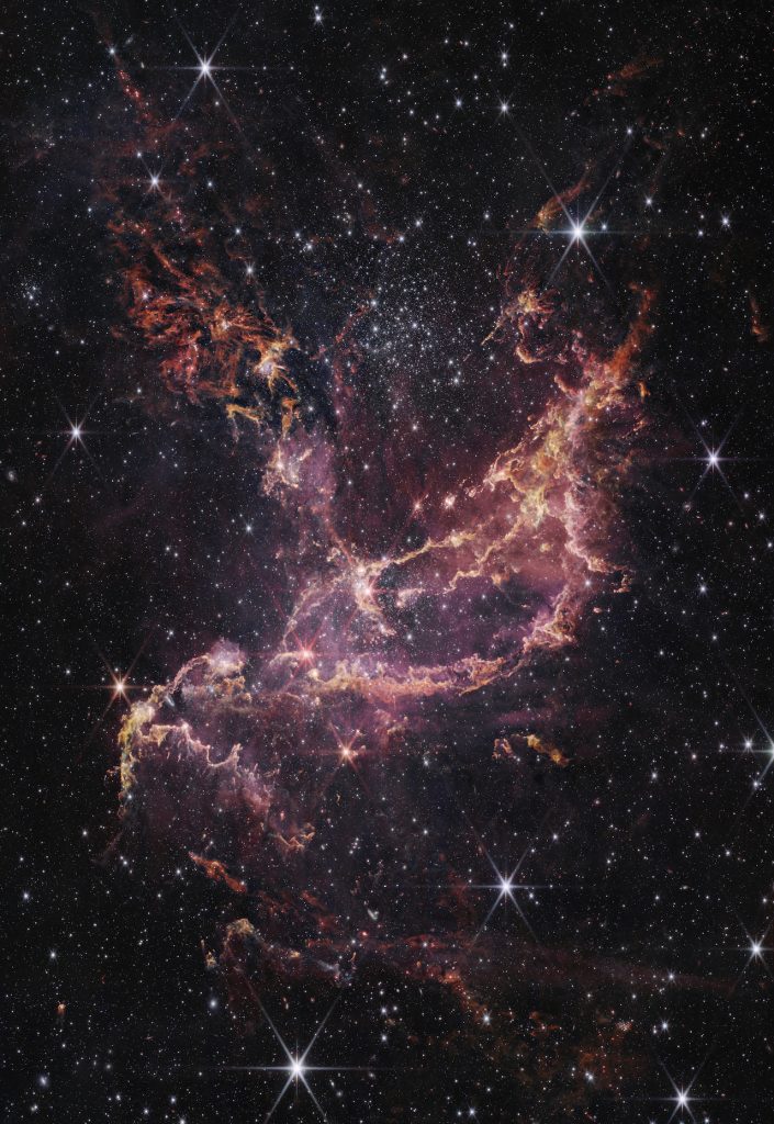 immagine per 12. L’ammasso aperto NGC 346, una regione di formazione stellare nella Piccola Nube di Magellano, a 200.000 anni luce dalla Terra.The open cluster NGC 346, a star-forming region in the Small Magellanic Cloud, 200,000 light years from Earth.Crediti: NASA, ESA, CSA, STScI, A. Pagan (STScI)
