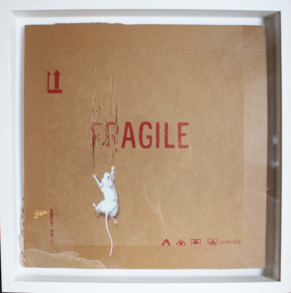 immagine per Banksy,Agile,2022,Hand-finished opera on cardboard,50x50 cm,handsigned