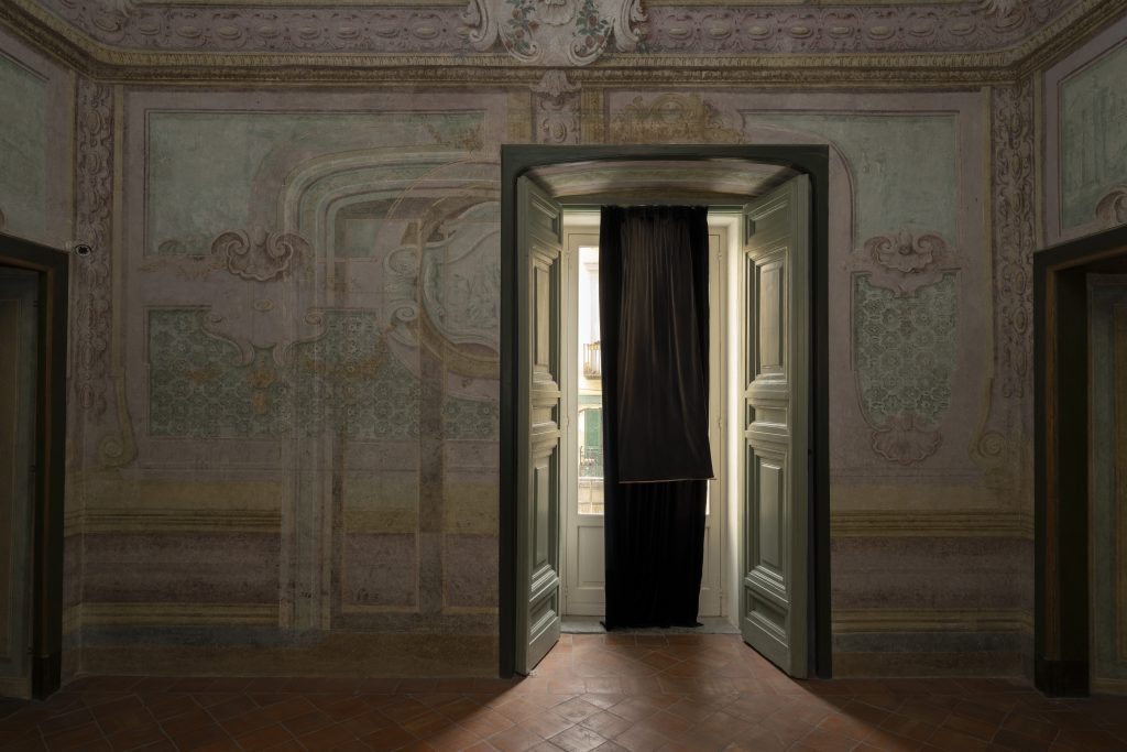 immagine per Carousel Curtain made for the bedroom in the artist’s apartment in Limassol. Used between 2020-2023. Fabric bought from George’s textiles in Limassol in 2020. Blue Velvet fabric with blackout backing, 2022; Marina Xenofontos; as part of Eternal, Returns; Fondazione Morra Greco; 2025; Photo by Amedeo Benestante; Courtesy Fondazione Morra Greco.