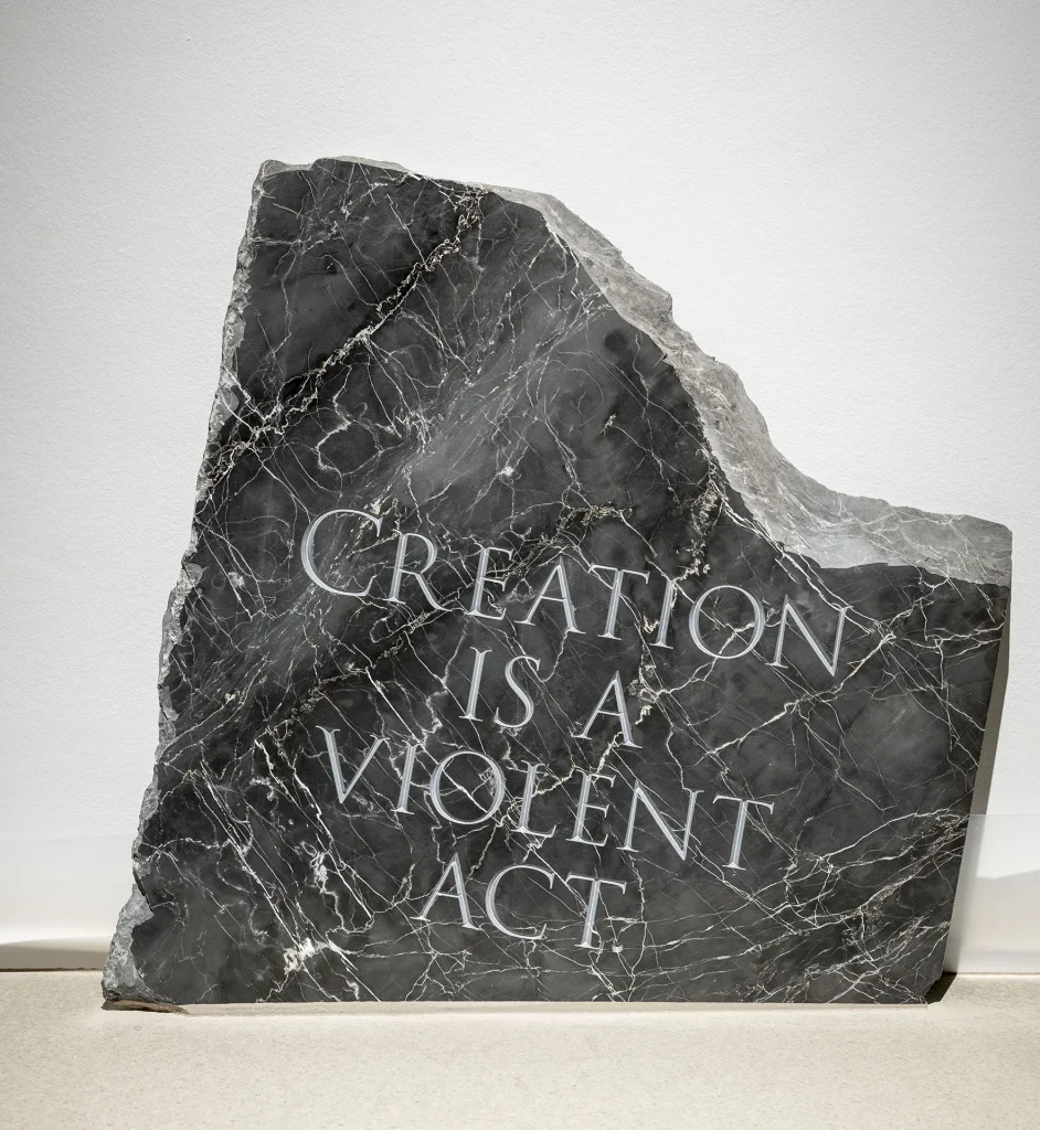 immagine per “Creation is a violent act”, 2026. Incisione su marmo Nero Portorto, cm 66x62x3. Courtesy l’artista e galleria Gilda Lavia, ph Giorgio Benni