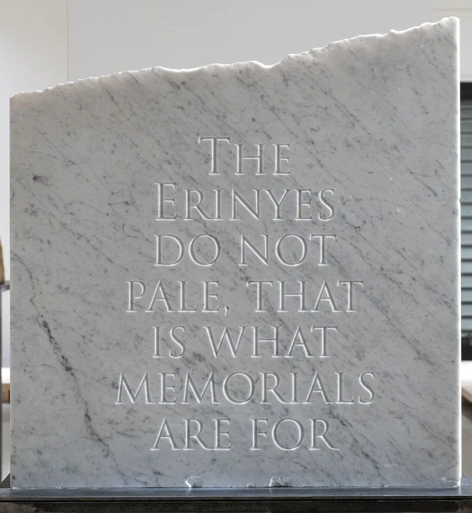 immagine per “The Erinyes do not pale, that is what memorials are for”, 2026. Incisione su marmo di Carrara, cm 62,5 x 60 x 15. Courtesy l’artista e galleria Gilda Lavia, ph Giorgio Benni