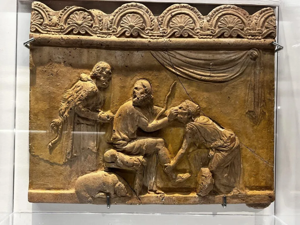 immagine per Euriclea riconosce Ulisse-lastra in terracotta del tipoCampana I sec. d.C. Museo Nazionale Romano